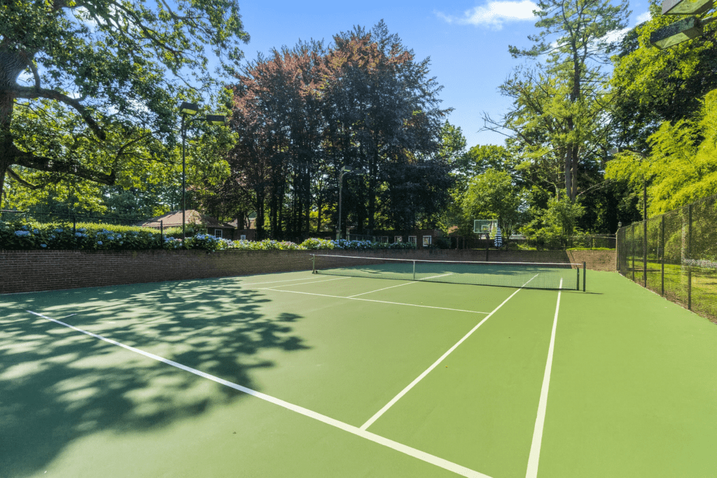 Tennis Court Amidst Lush Greens